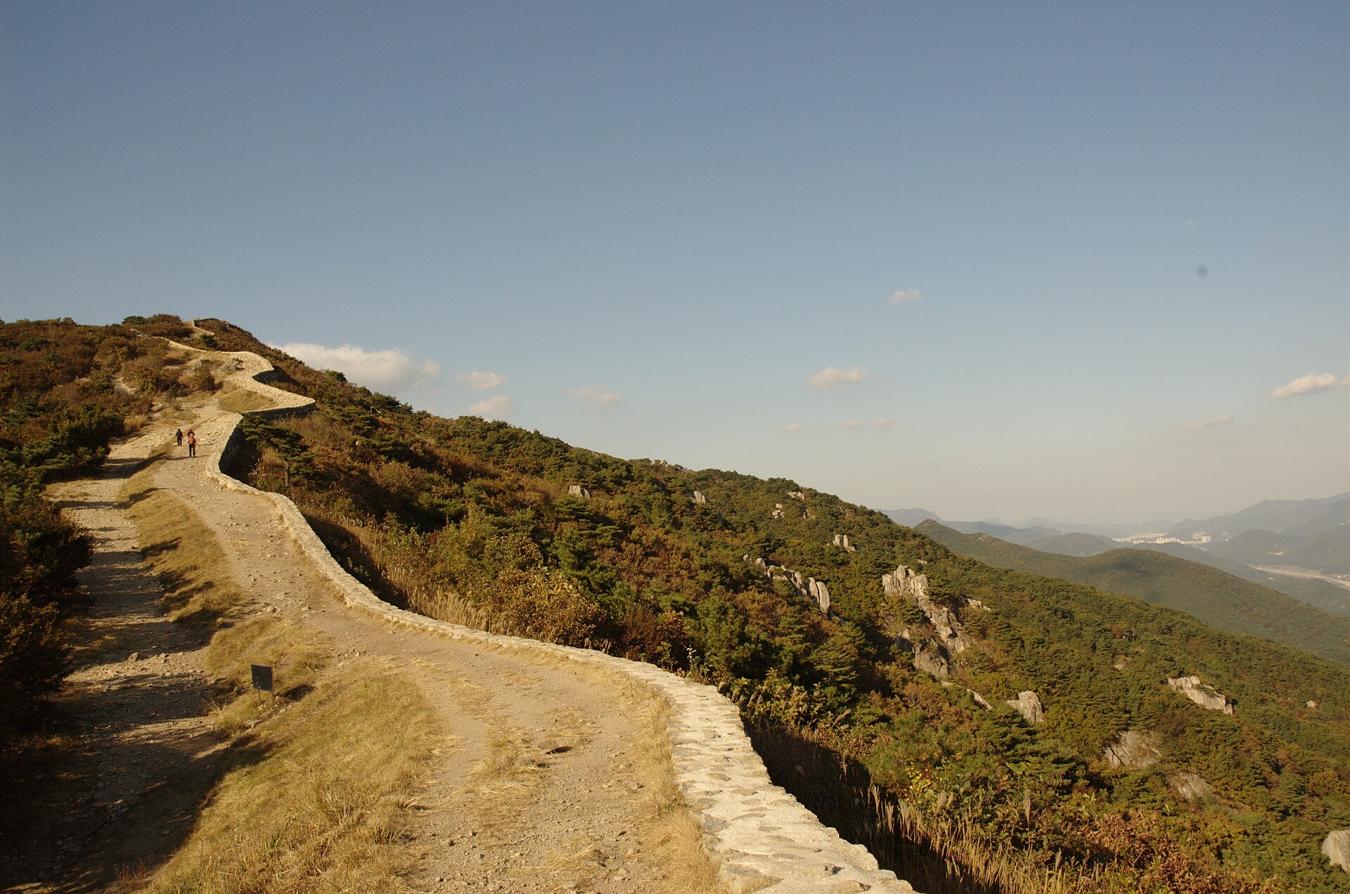 The stone walls and gate of Geumjeong Fortress on the mountain above Busan
